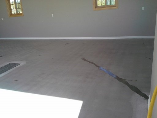 We make necessary crack repairs and fill spalls in the floor before coating.